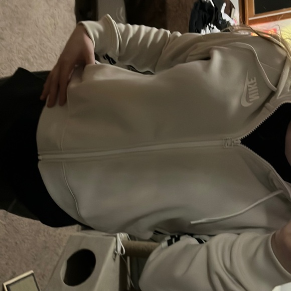 Cream/off-white Nike jacket w/ black and green stripe down the side - Picture 2 of 5